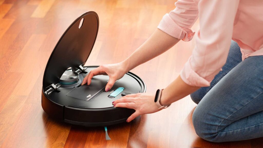 woman using mobile phone in robot vacuum.