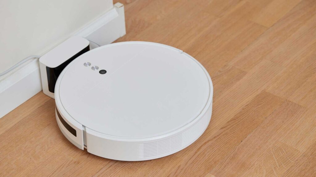 vacuum cleaner on a laminated wooden floor.