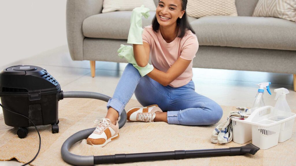 woman vacuum cleaner replace broom cleaning in living room.