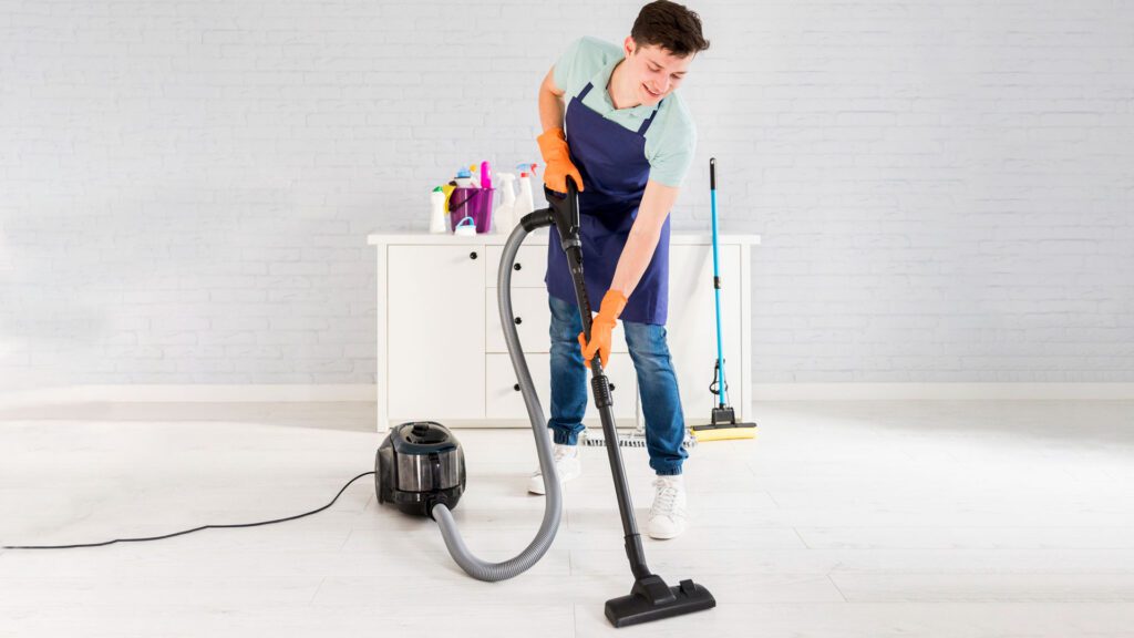 man cleaning room with high Vacuum Suction Power vacuum