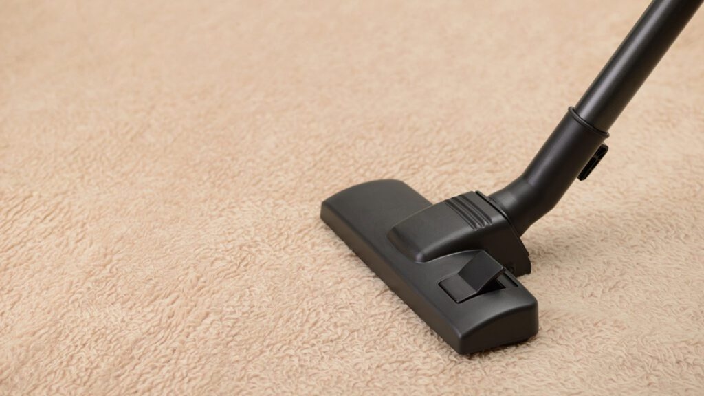 cleaning carpet with plain suction vacuum