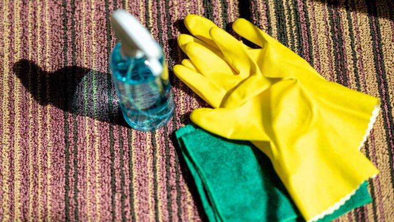 carpet cleaning with yellow gloves