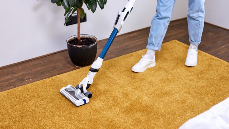 vacuuming the carpet